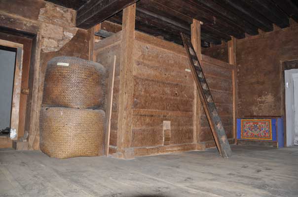 Wooden silos (zodh) and bamboo containers (yuwa), storage containers for food grains